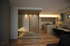 オープンプランのタタミスペースは、木目調の床と落ち着いた色合いのインテリアが調和。リラクゼーションと機能性を同時に提供。