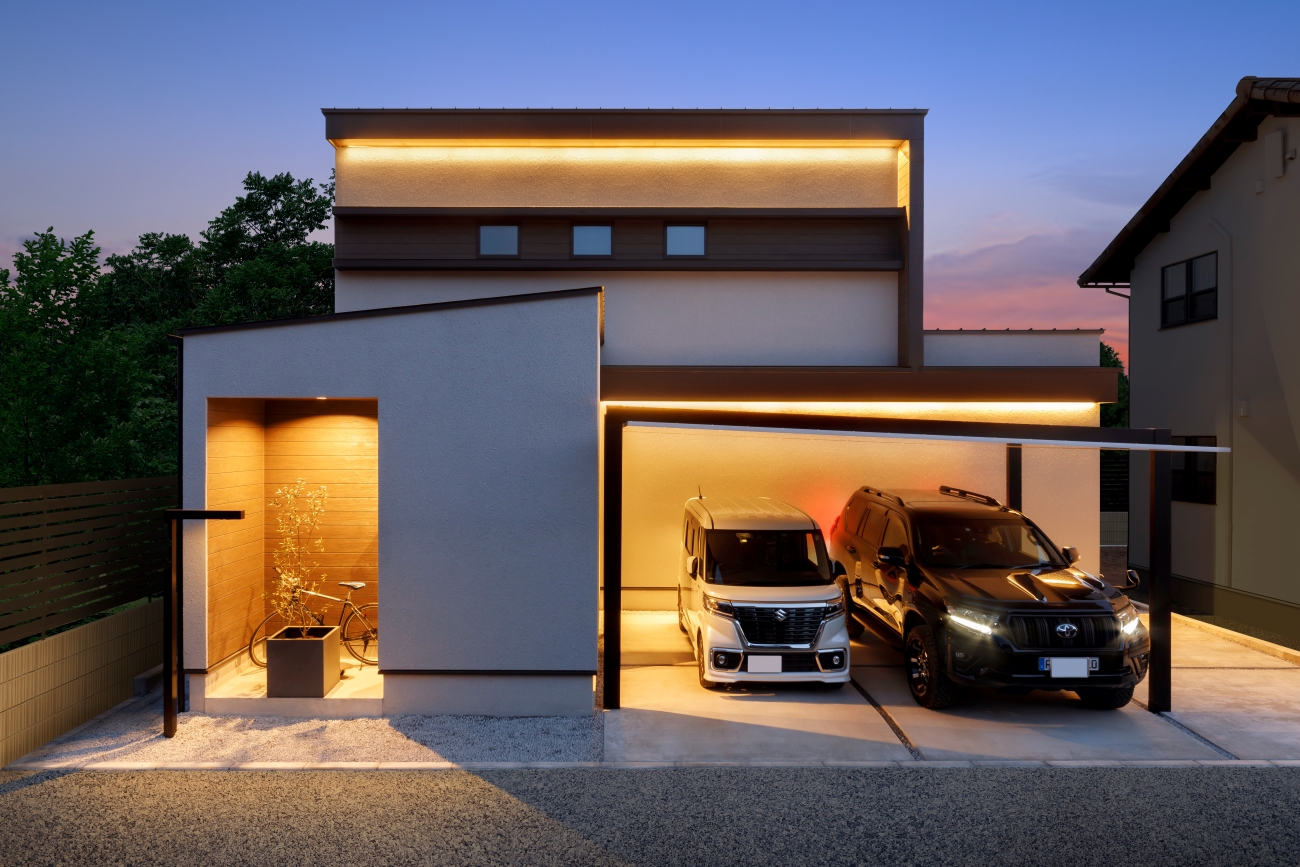 nattoku住宅【デザイン住宅、子育て、間取り】ラインを取り入れたデザインが特徴的なシャープでモダンな外観。夕方からは軒下に施された2本のライン照明が、学校や会社からの帰宅をあたたかく迎える。ほどよくプライバシーを守る玄関ポーチのおかげで、雨の日もストレスなく出入りすることが可能