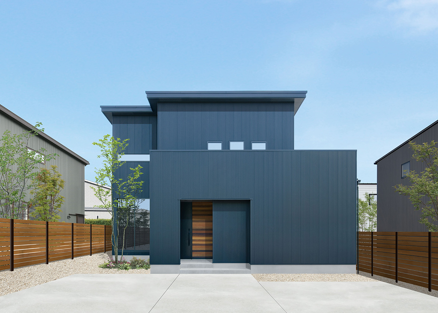 DAITOKU（大得工務店）【デザイン住宅、省エネ、間取り】フォルムが美しい外観デザイン。外壁は断熱性、耐久性、メンテナンス性に優れたガルバリウム鋼板を使用。敷地の特性を活かして、建物の北側に庭を配置した。屋根には初期費用0円の太陽光発電（13.23kW）を搭載し、光熱費は毎月黒字に