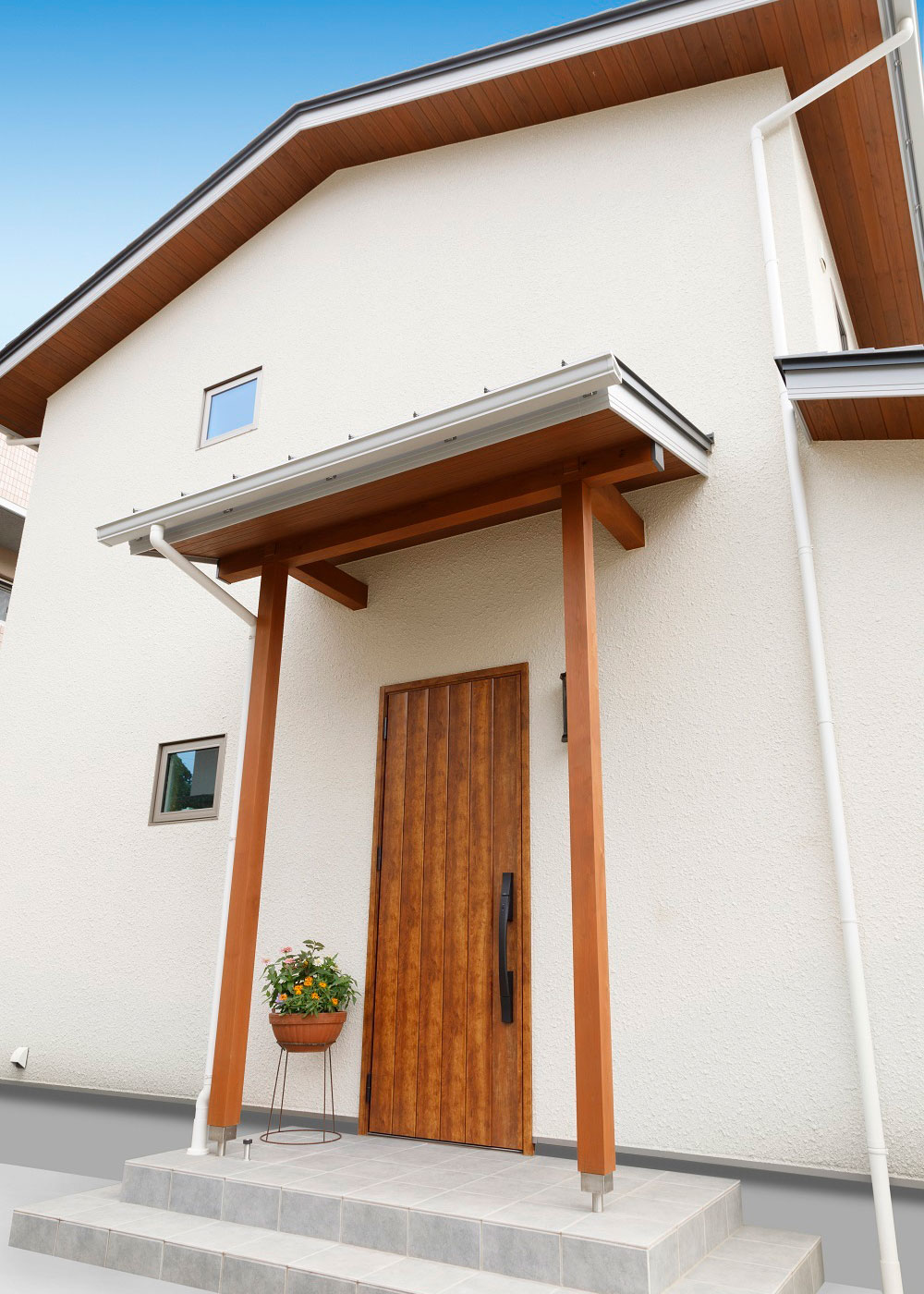 フジモクの家（富士木材）【二世帯住宅、自然素材、間取り】玄関側はスギの軒天により、やわらかな表情