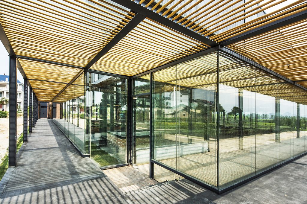 Corner of the glazed factory with a bamboo-shaded walkway