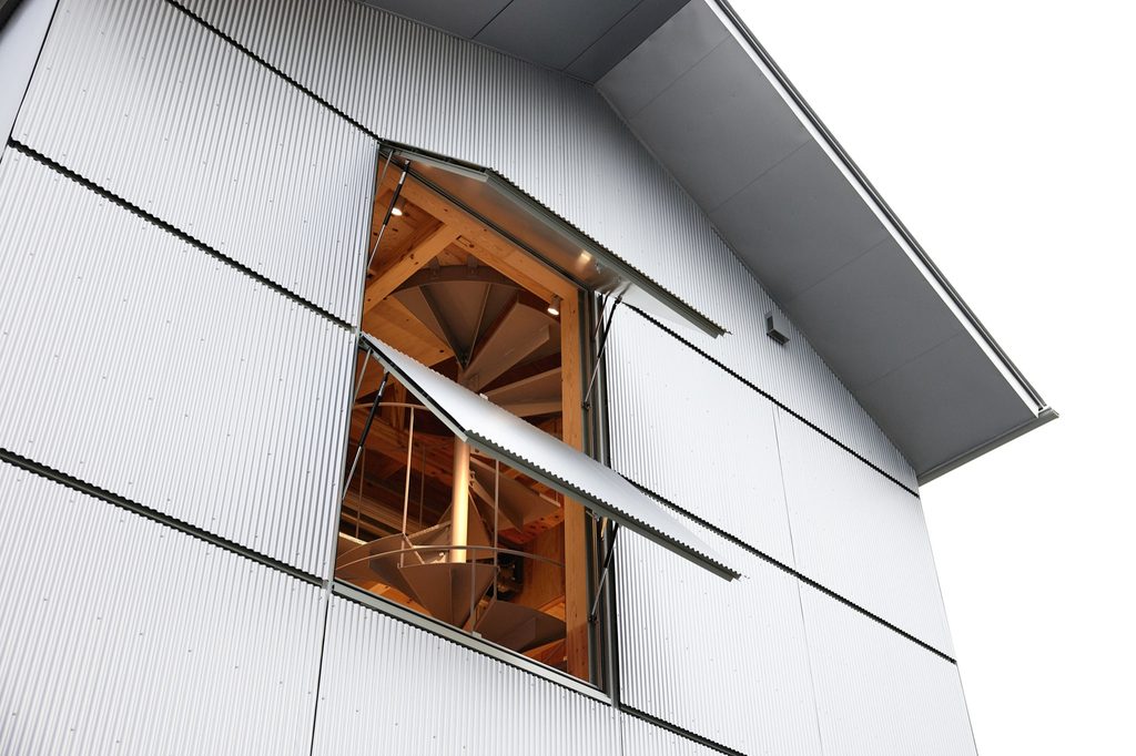 Timber interior seen through an open window
