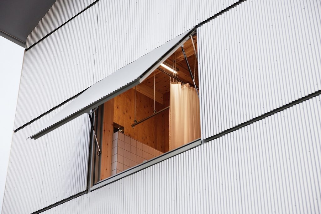 Awning window opening into the timber interior