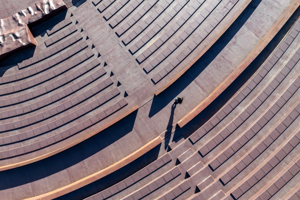 Curved seating rows and a central stair