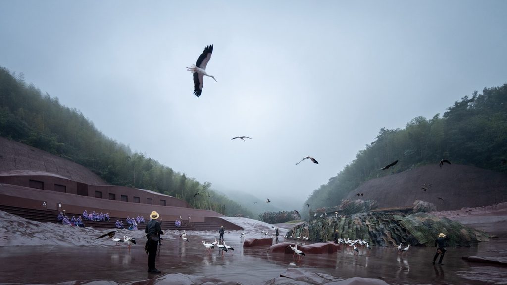 Birds flying across the wet performance area