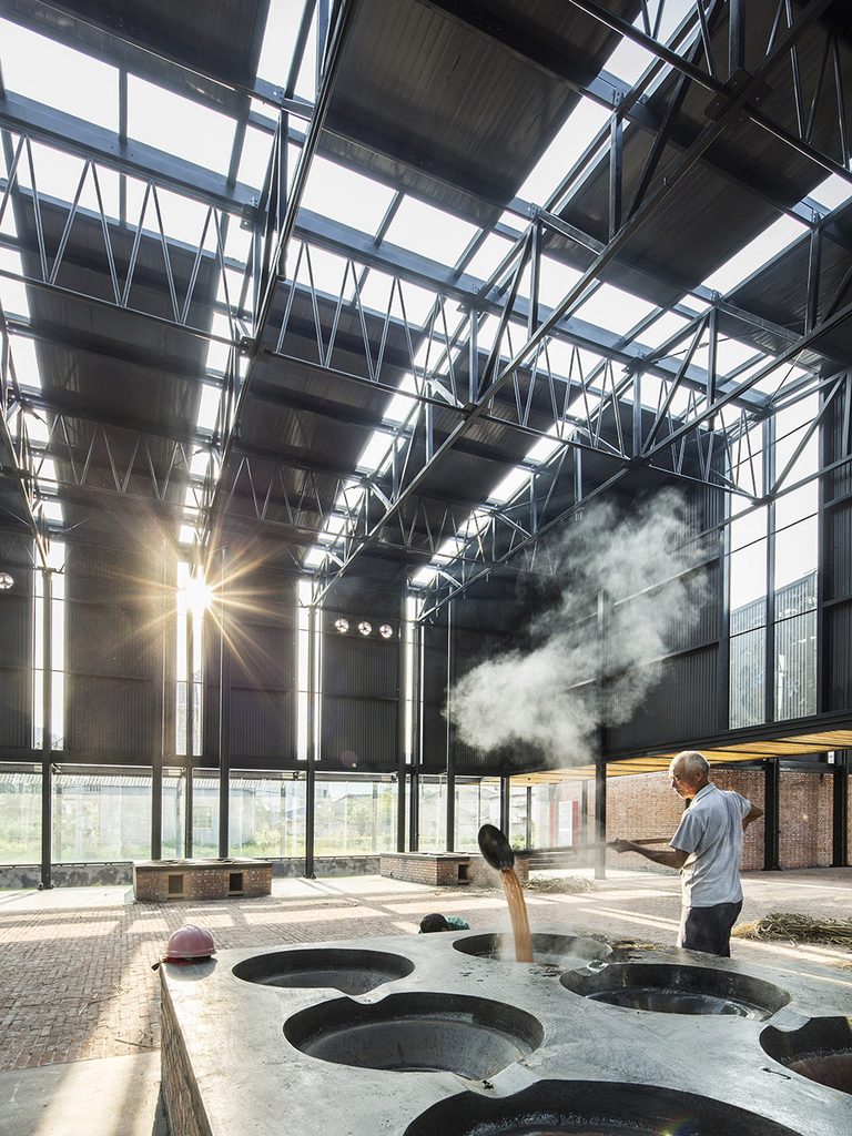 Sunlight and steam above the sugar-making pots