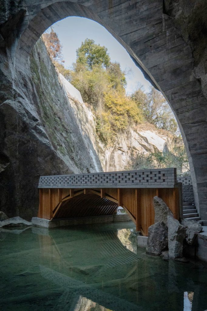 Bridge framing the water beneath the rock opening
