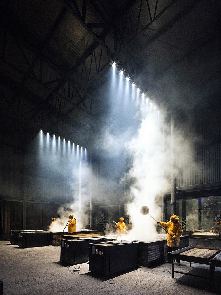 Steam and sunlight above the working sugar factory