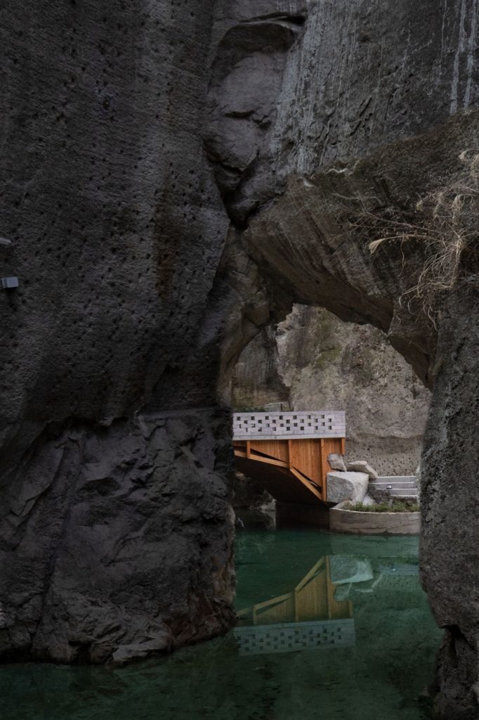 Small timber-supported platform between rock walls