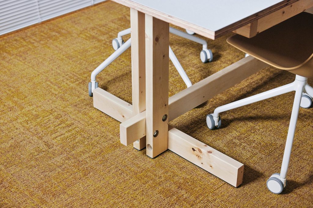 Timber furniture detail on the carpet