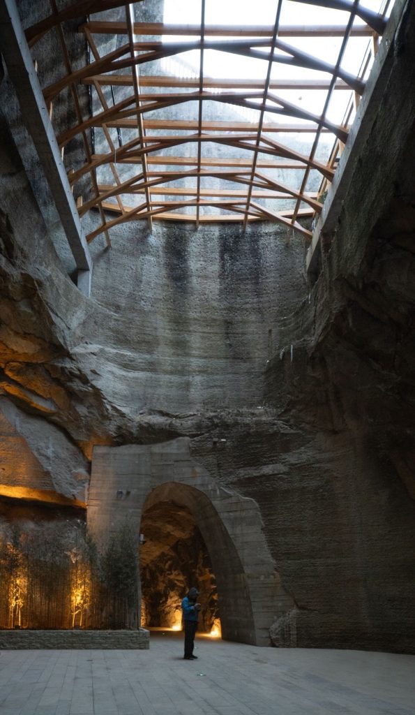Timber lattice roof above a tall quarry chamber