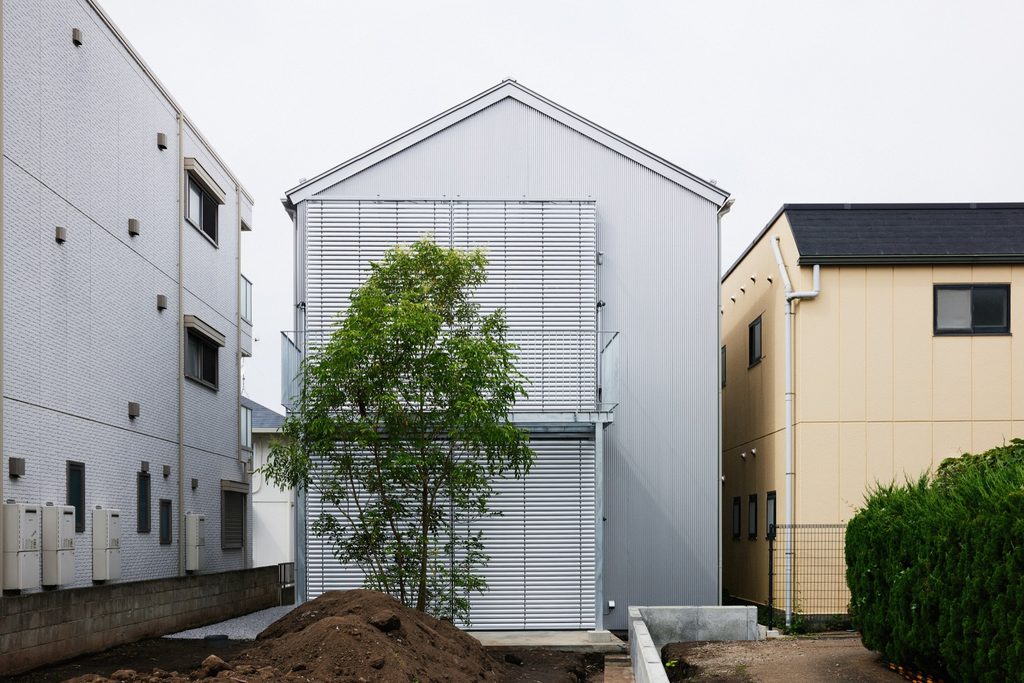 Rear of the building with a young tree
