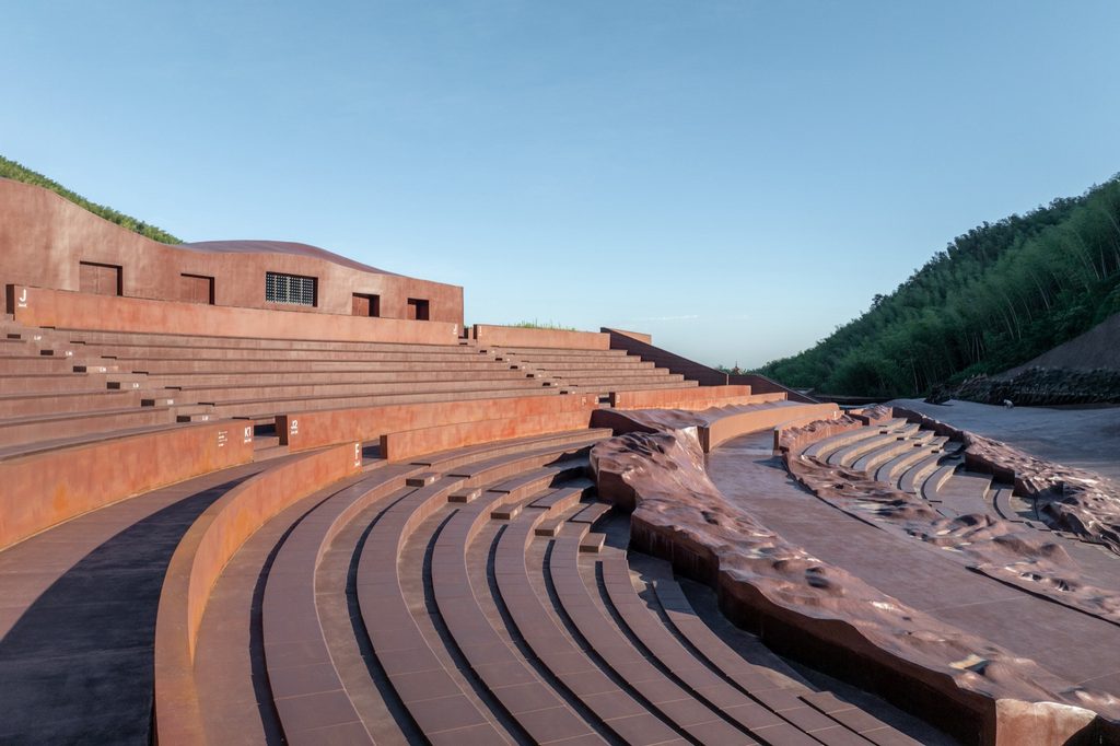 Curved auditorium seating in afternoon light
