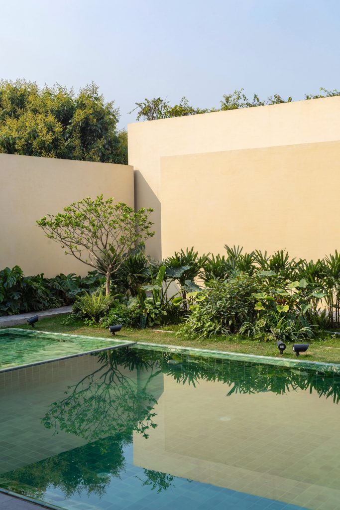 100 Windows by Inrestudio, Hanoi, walled back garden on the ground floor