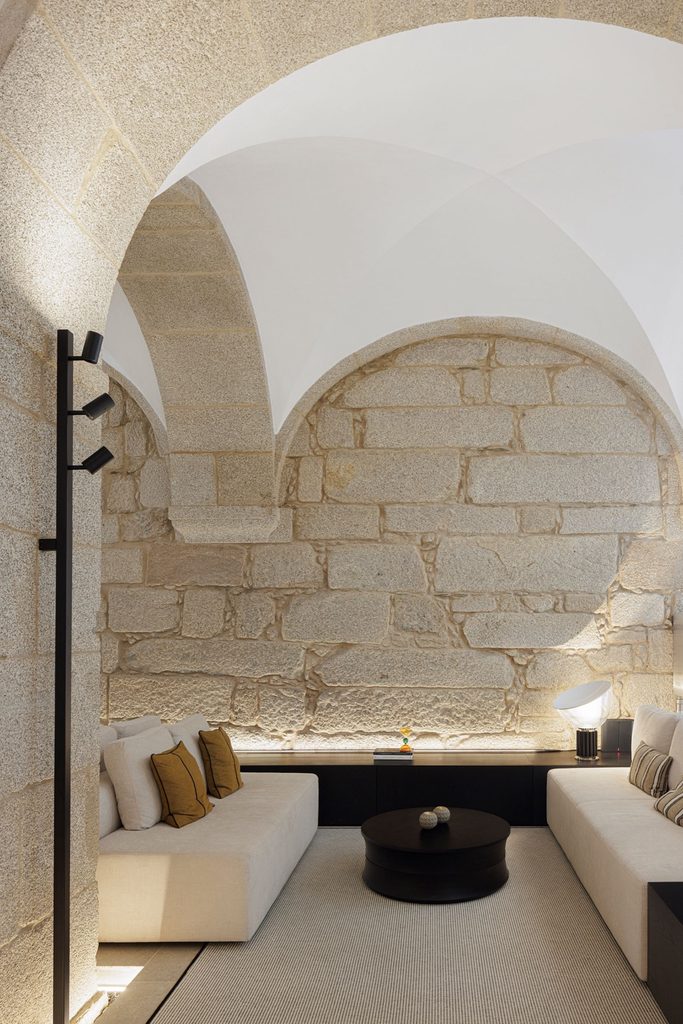 Lounge seating beneath a stone arch