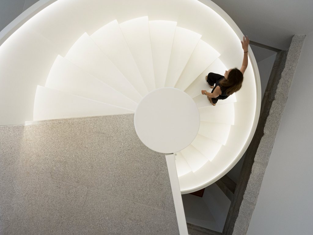 Overhead view of the illuminated spiral staircase