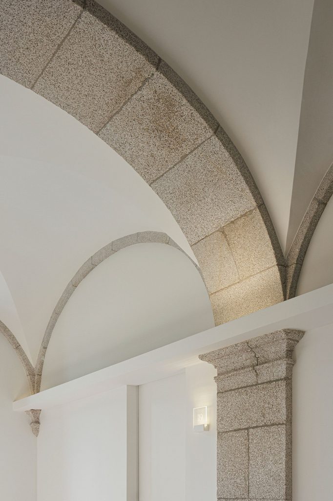 Stone ribs framing a white vaulted ceiling