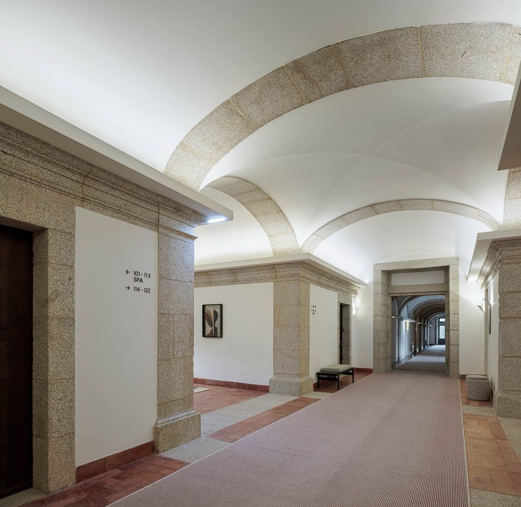 Upper hall with stone door surrounds and terracotta floor tiles