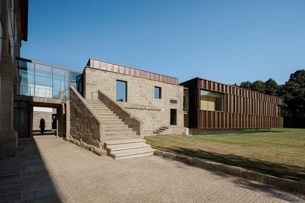 Exterior stone staircase beside the glazed connection to the spa