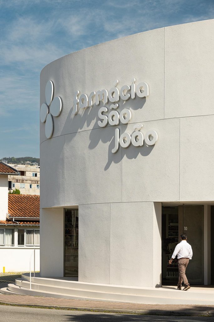 Pharmacy entrance beneath raised lettering
