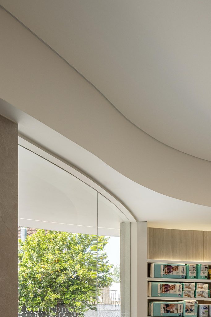 Curved glazing and shelving beside the entrance