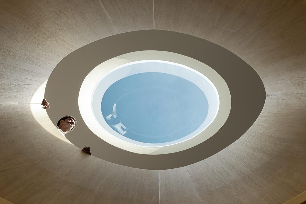 View upwards through the oval opening towards the skylight