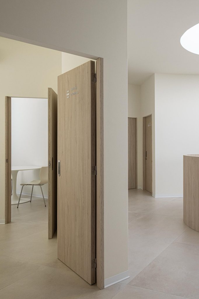 Upper corridor with open doors to service rooms