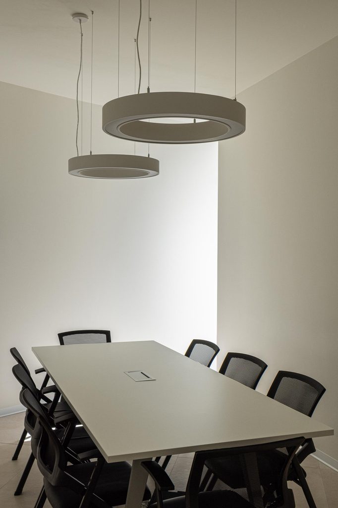 Meeting room with circular pendant lights