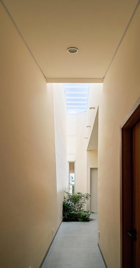 Slot of space lit from a skylight above