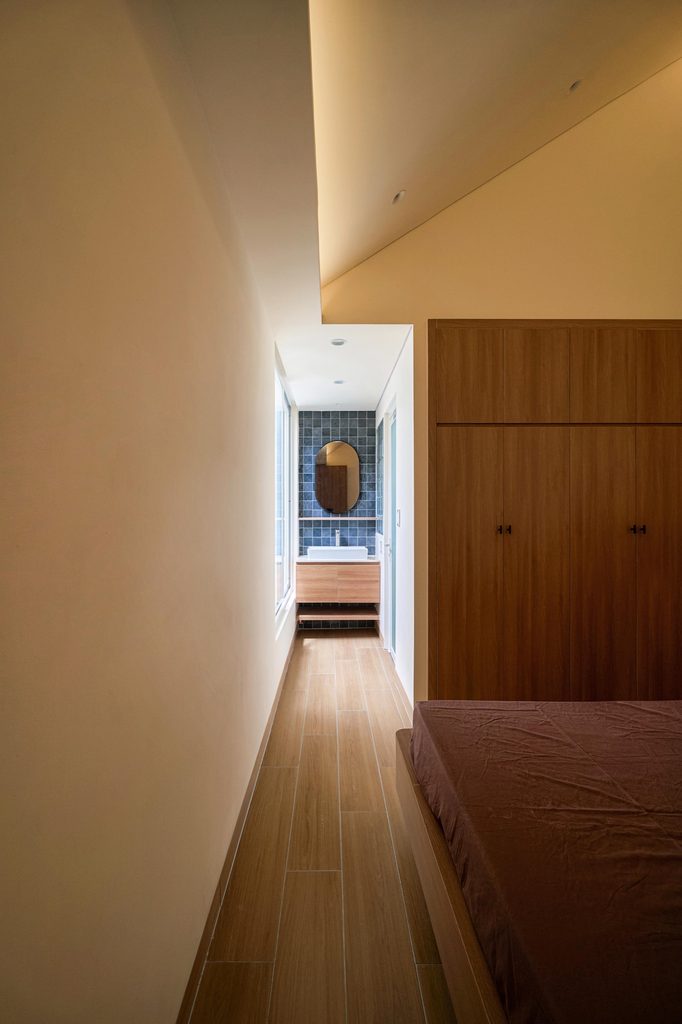 Timber-floored corridor along the bedrooms