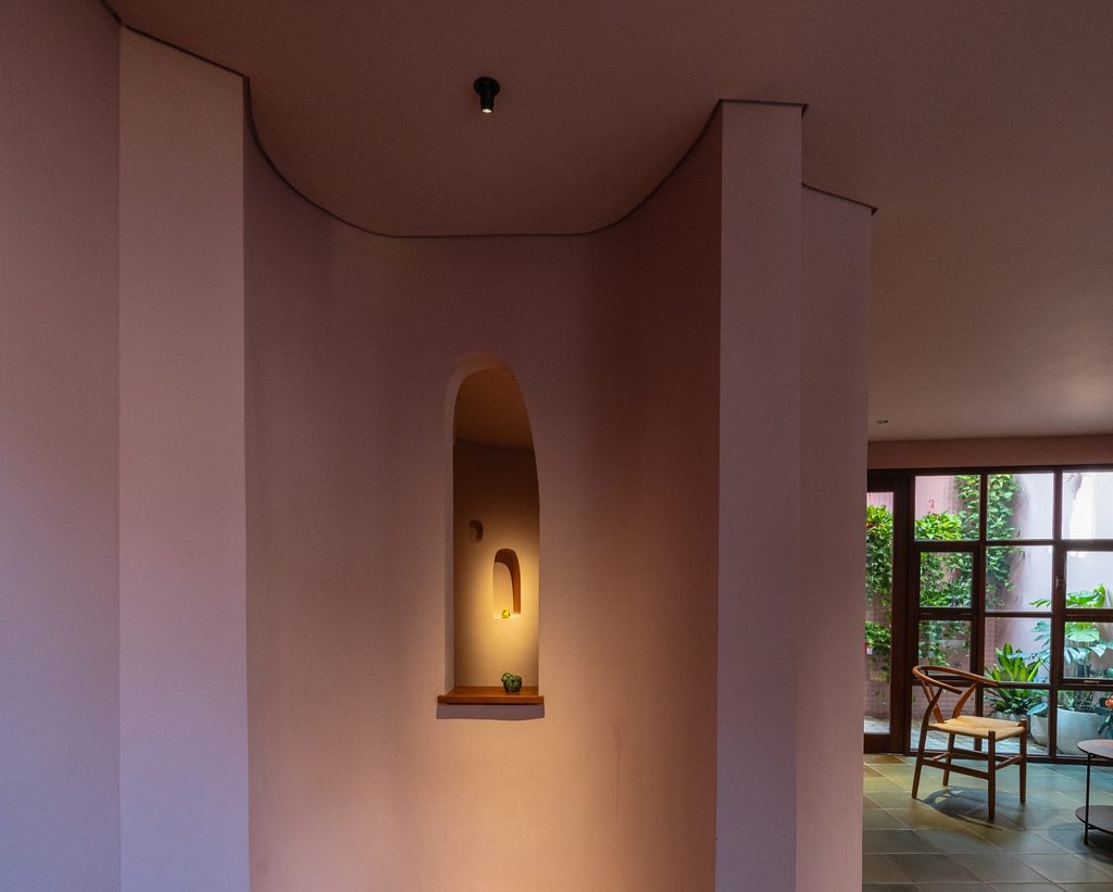 Lit wall niche beside courtyard seating