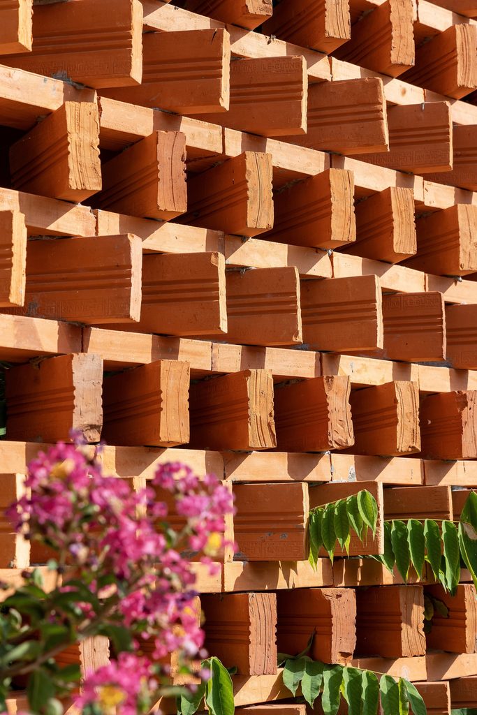Reclaimed terracotta bricks arranged with open gaps