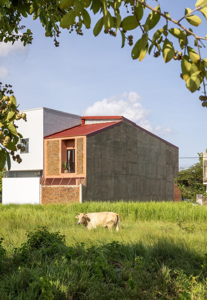 House beside an open grassy plot