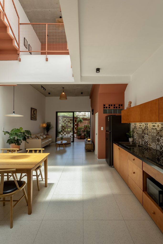 Kitchen and dining area beneath the upper walkway