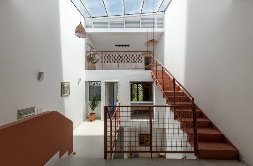 Central staircase and upper walkway beneath the rooflight