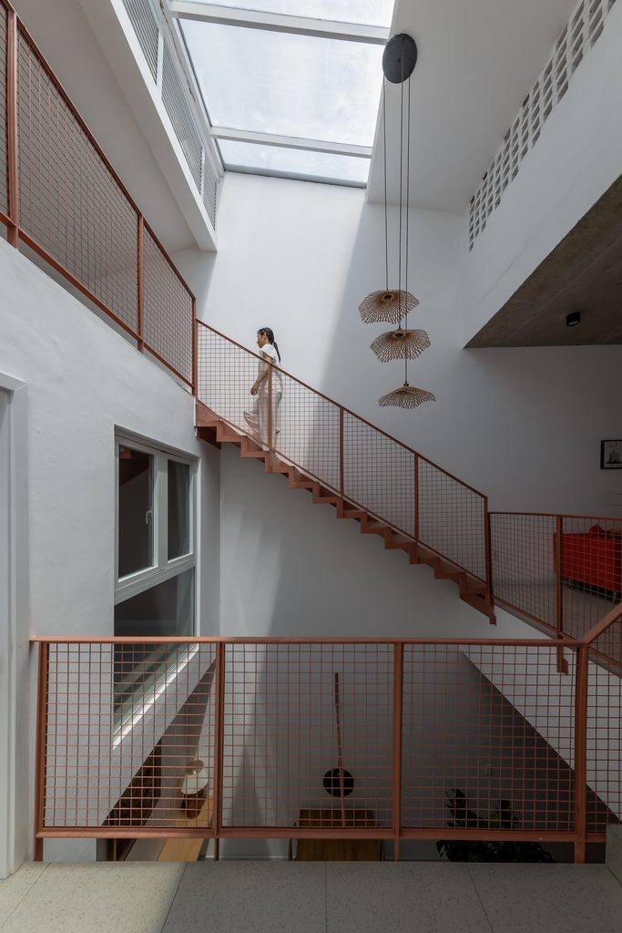 Staircase rising through the central rooflit void