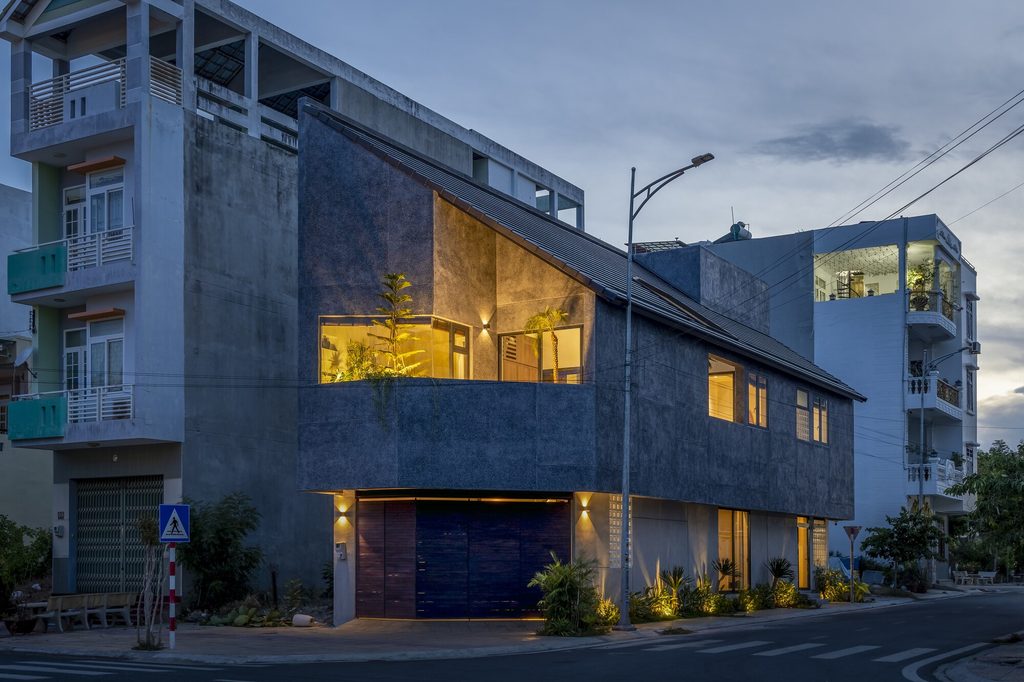 Corner facade illuminated at dusk