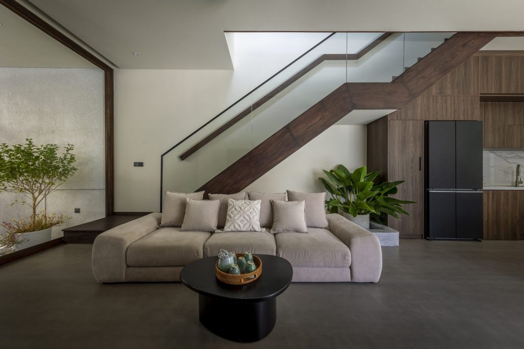 Living room beneath the staircase with timber cabinetry