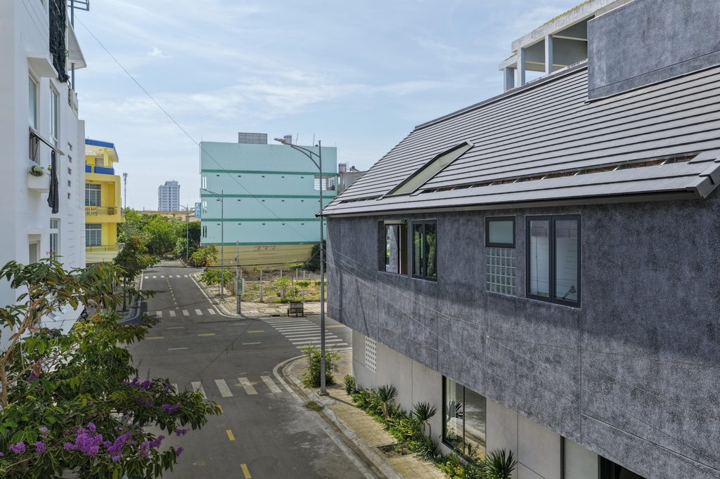 Sloping roof and upper windows facing the street