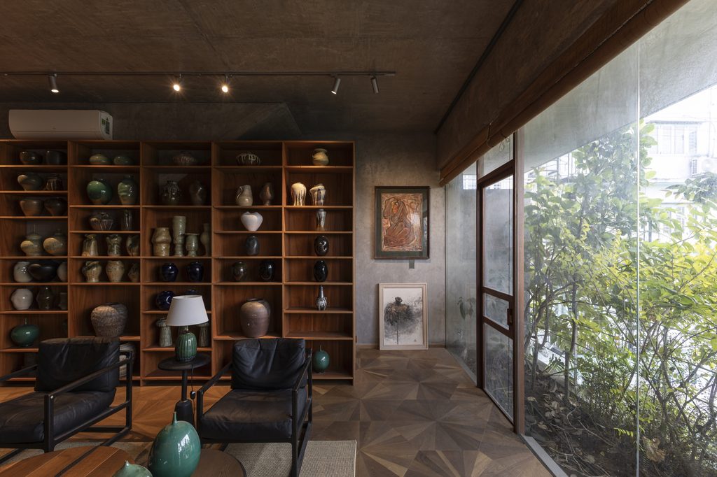 Timber shelving and desk beside a glass wall