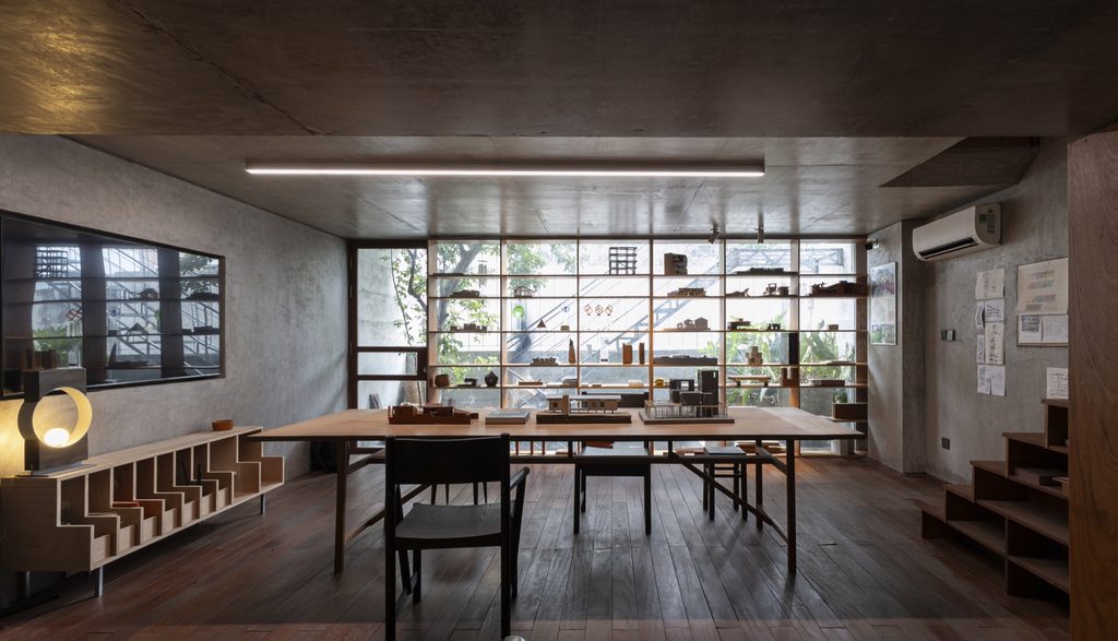 Long work table under the concrete ceiling