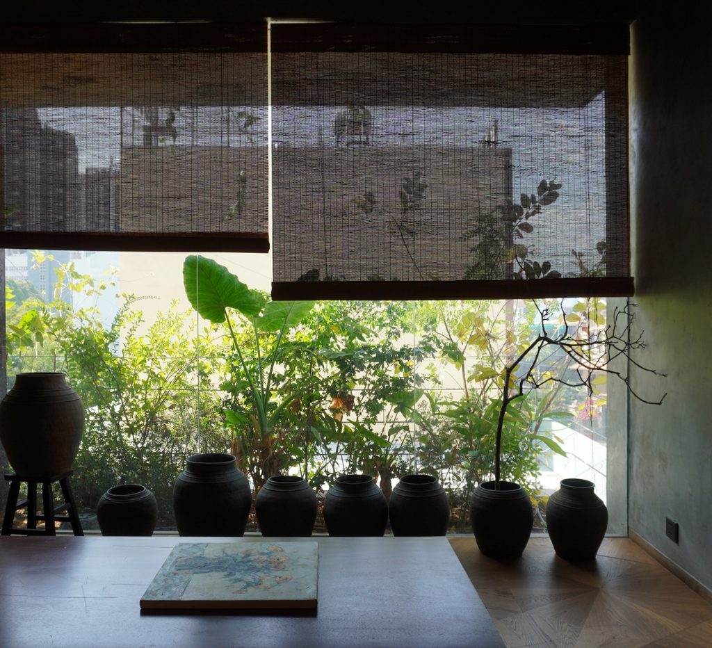 Pots on a sill looking out to the garden