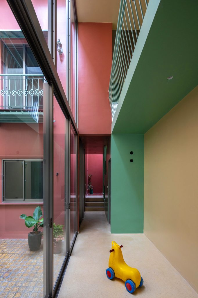 Glazed passage beside the courtyard beneath an upper walkway
