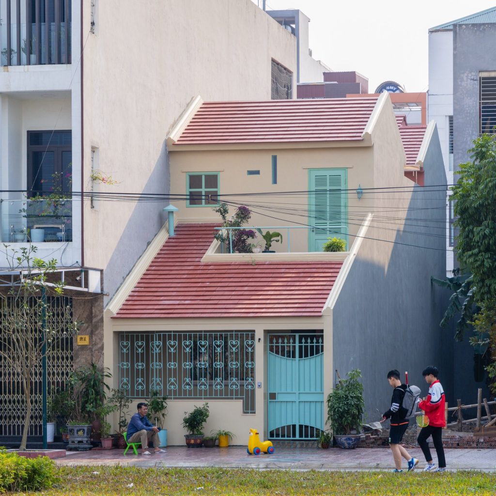 Street view of the house between taller neighbours