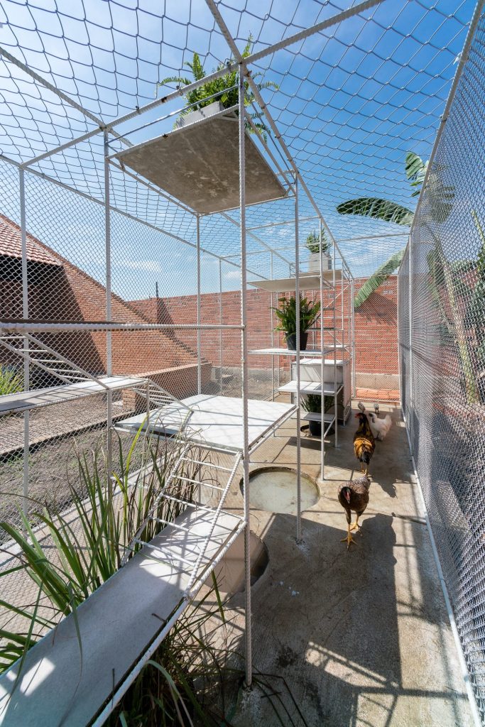 Mesh walls and stacked boxes in daylight