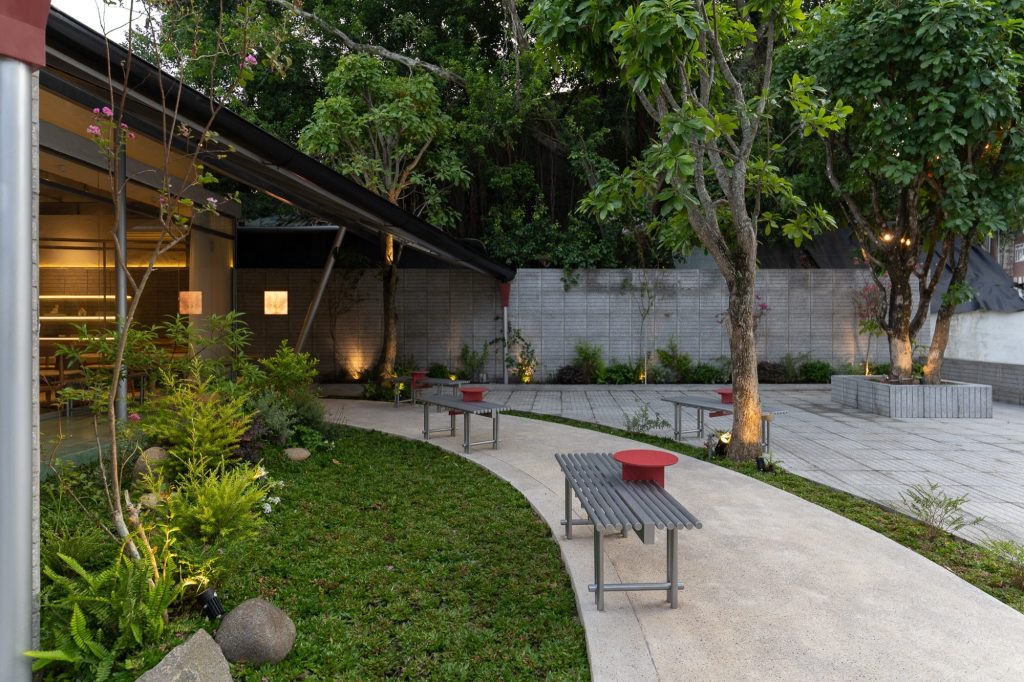 Garden path with a bench and planting