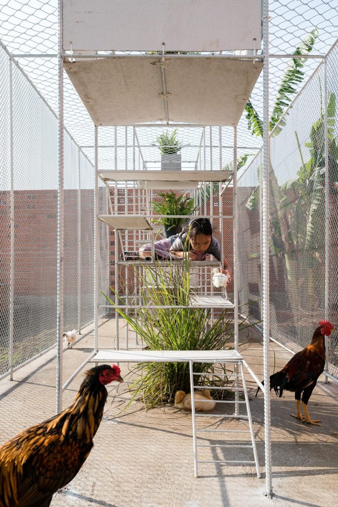 Hanging boxes at several levels with a child above
