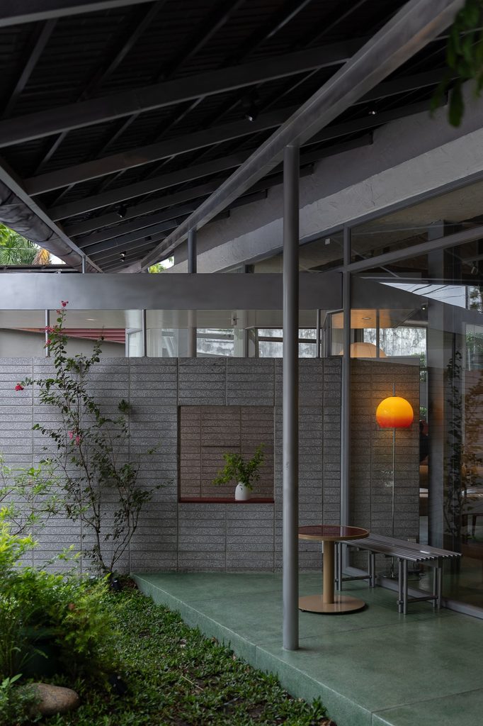 Garden corner framed by the roof and brick wall