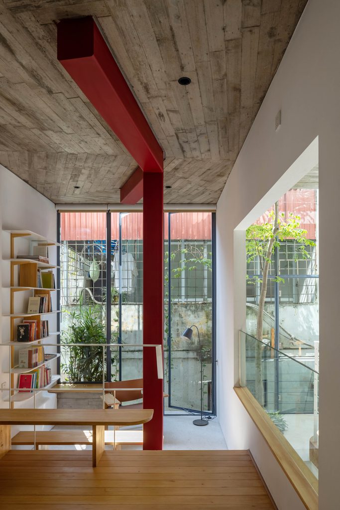Reading area beside the red column and tall windows