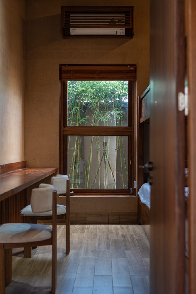 Compact room with desk and timber window
